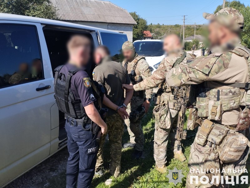 Armed man in military uniform detained after shooting