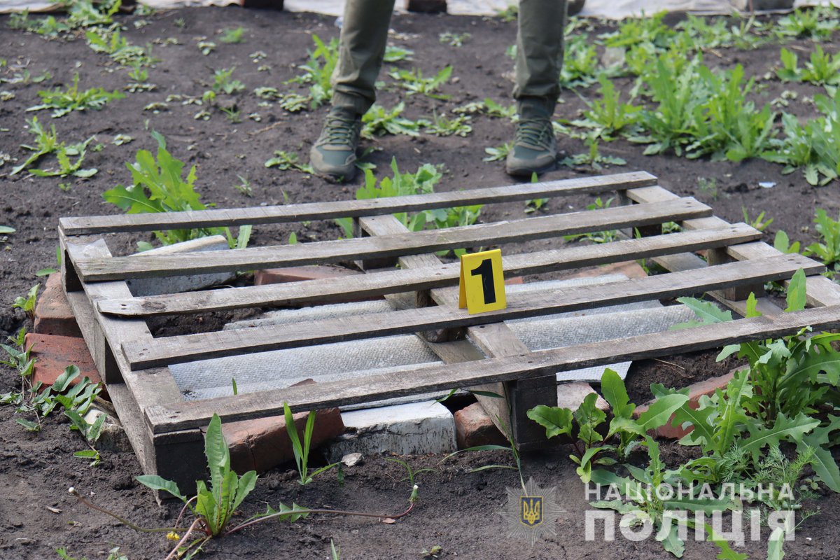 People carry their child in sacks after deaths in Kharkiv