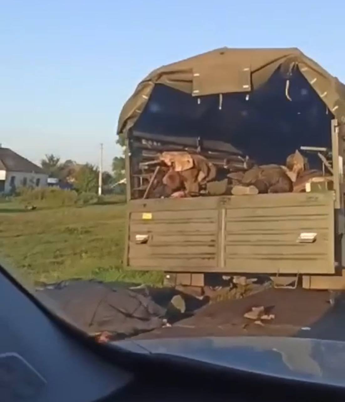Mountains of Russian corpses in Zhovtnevyi: burnt convoy destroyed