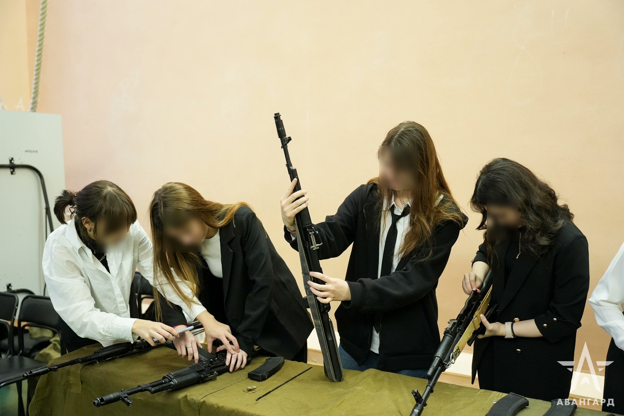 Russia sues schools for prioritizing education over war preparedness with replica weapons.