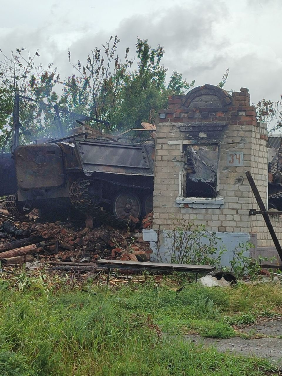 Destroyed Russian MT-LB crashes into house in Vovchansk