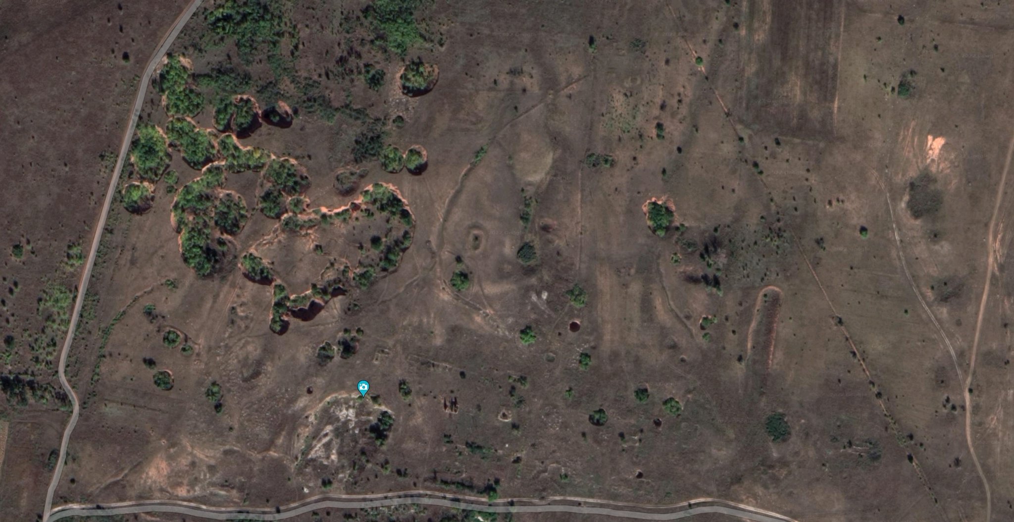 Sinkholes and cave entrances north of Volodymyrivka on Google