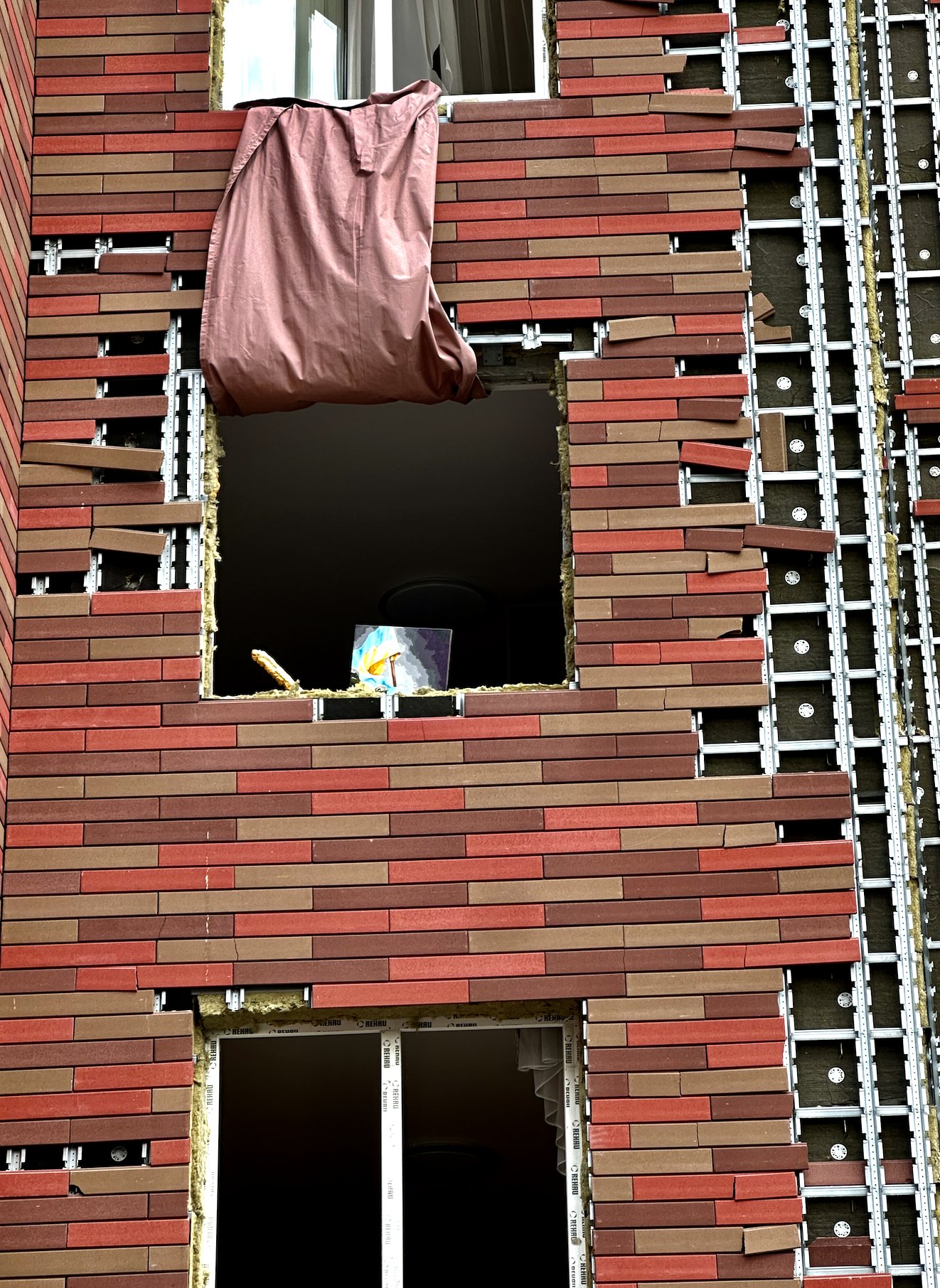 Ukrainian flag painting in Kyiv apartment struck