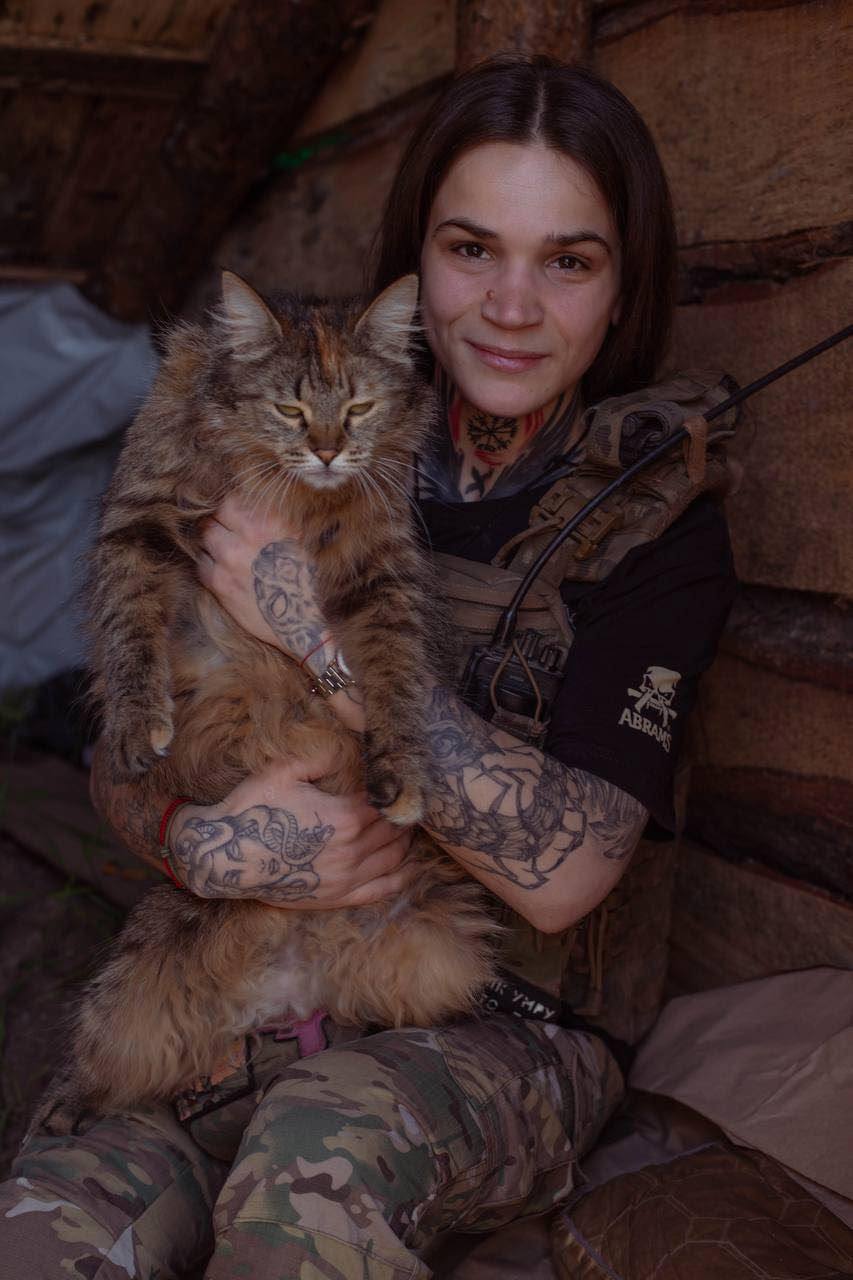 Female soldier with Crimean cat on duty