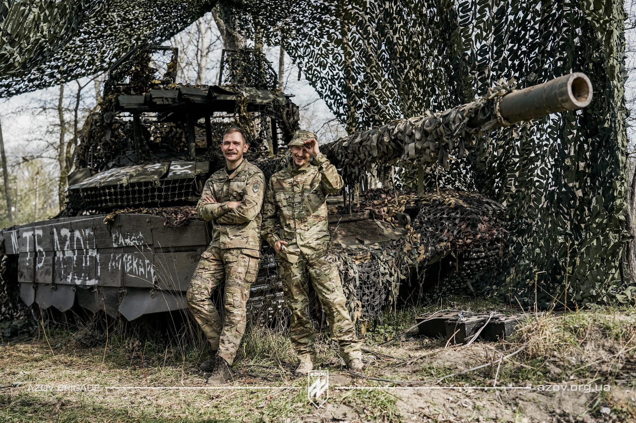Ukrainian warriors Tenor and Baydar near captured T-72B3M