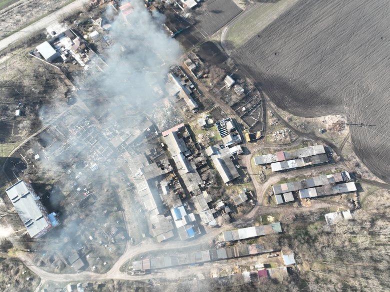 Russian soldiers run under tank fire near Kharkiv