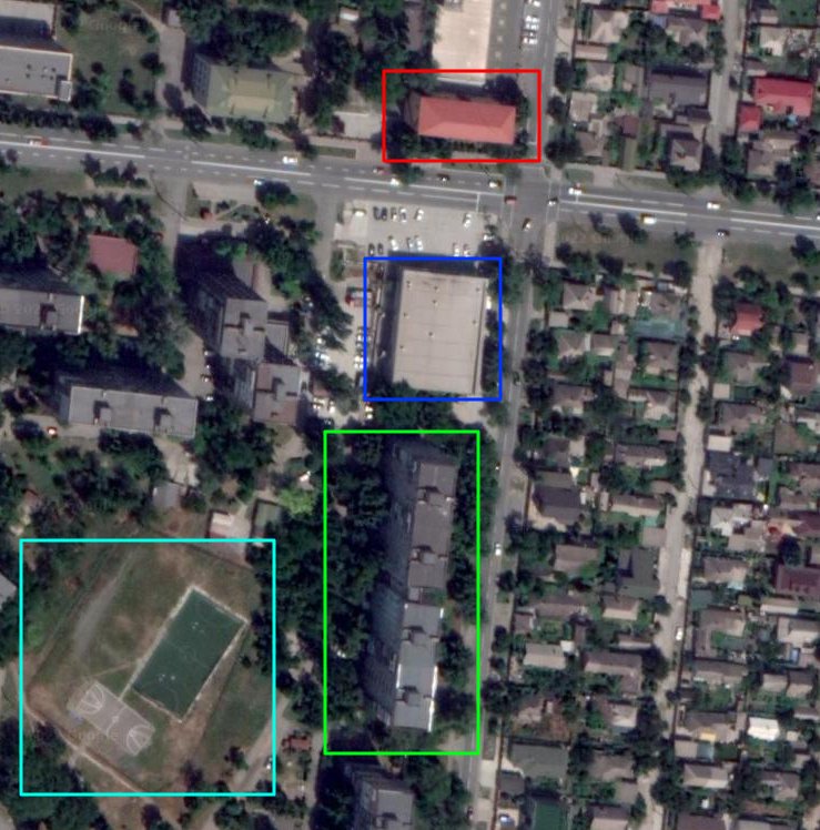 Damaged buildings and fire department in Western Mariupol