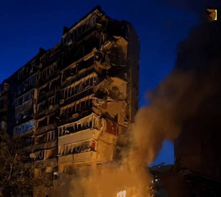Rescuers try to save people trapped under rubble in Kyiv after Russian missile