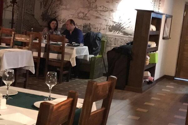 Photo of collaborator in destroyed restaurant