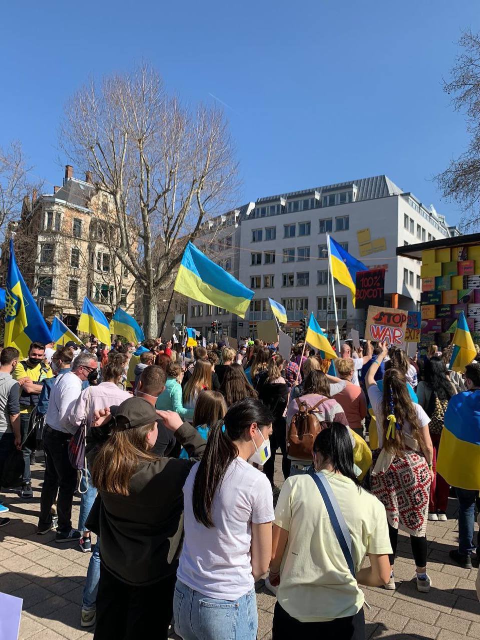 People rally with Ukrainian flags to support Mariupol defenders
