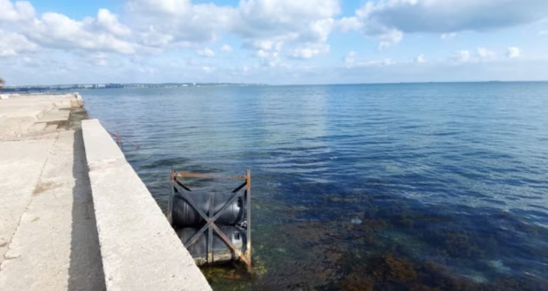 Part of Kerch Bridge boom barriers washed ashore in Crimea