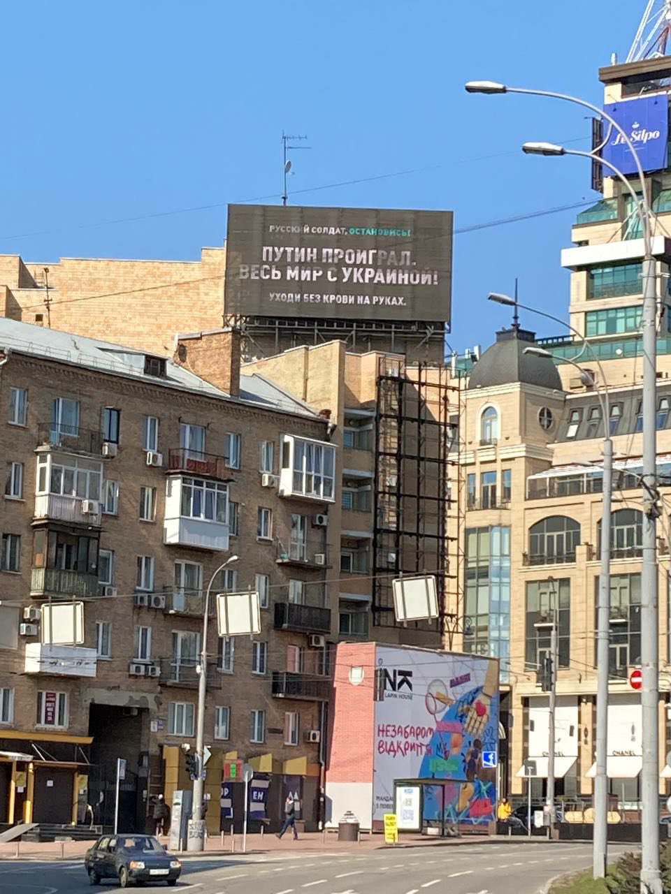 In Kyiv, banners urging Russians not to kill