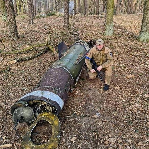 Ukrainian soldier near downed Russian missile