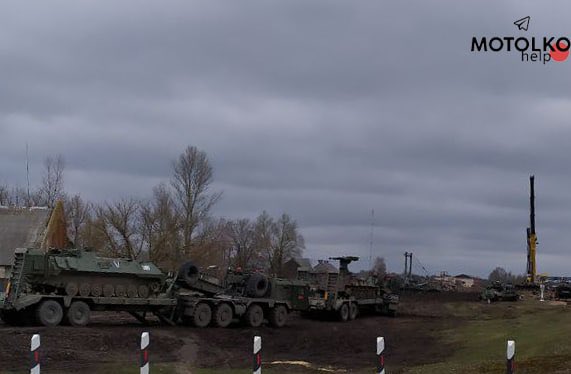 Damaged Russian armored vehicles loaded onto train