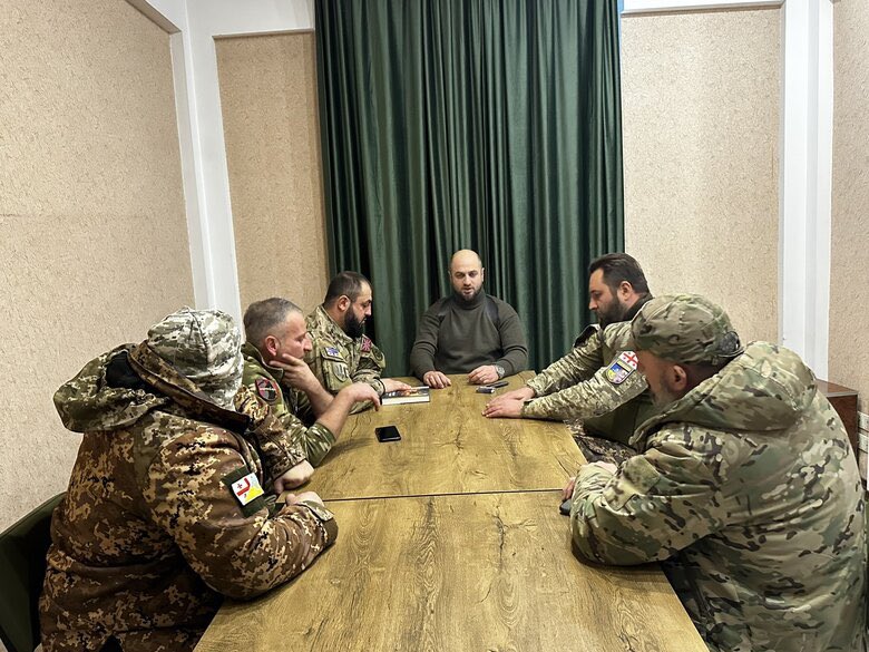Georgian Volunteers Return Amid Protests
