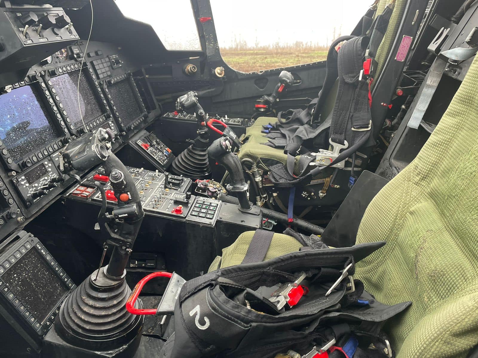 Ukrainian fighters inspect downed Russian helicopter