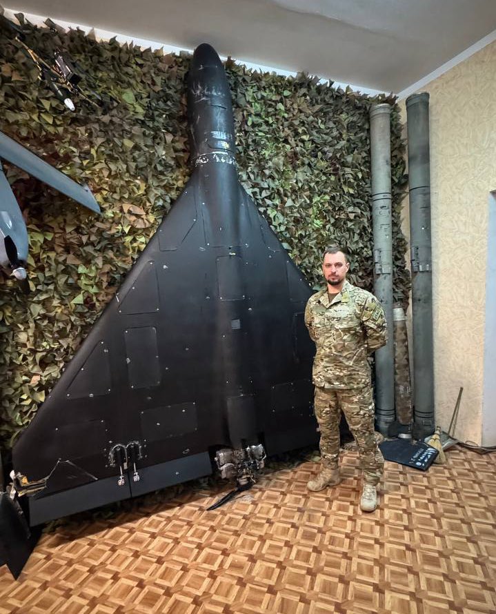 Russian kamikaze Shahed drone and Ukrainian soldier