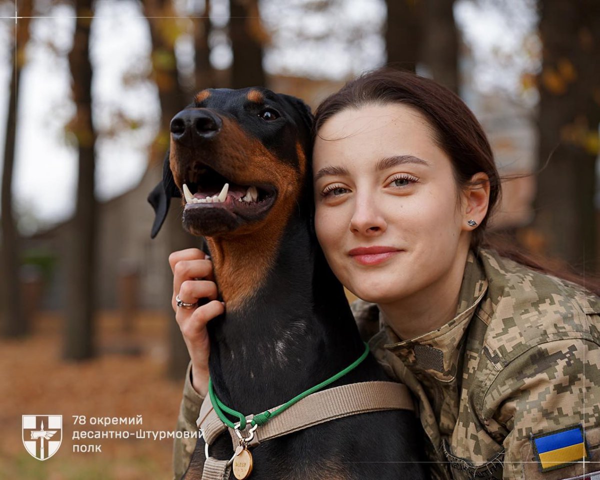 Soldiers and furry companions protect Ukraine with unwavering resolve.