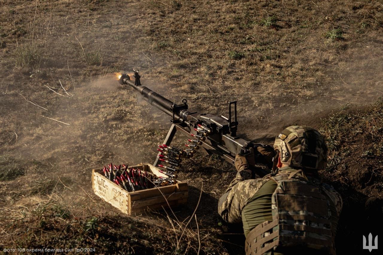 Defenders deliver 12.7 mm arguments to occupiers (max 12 words)