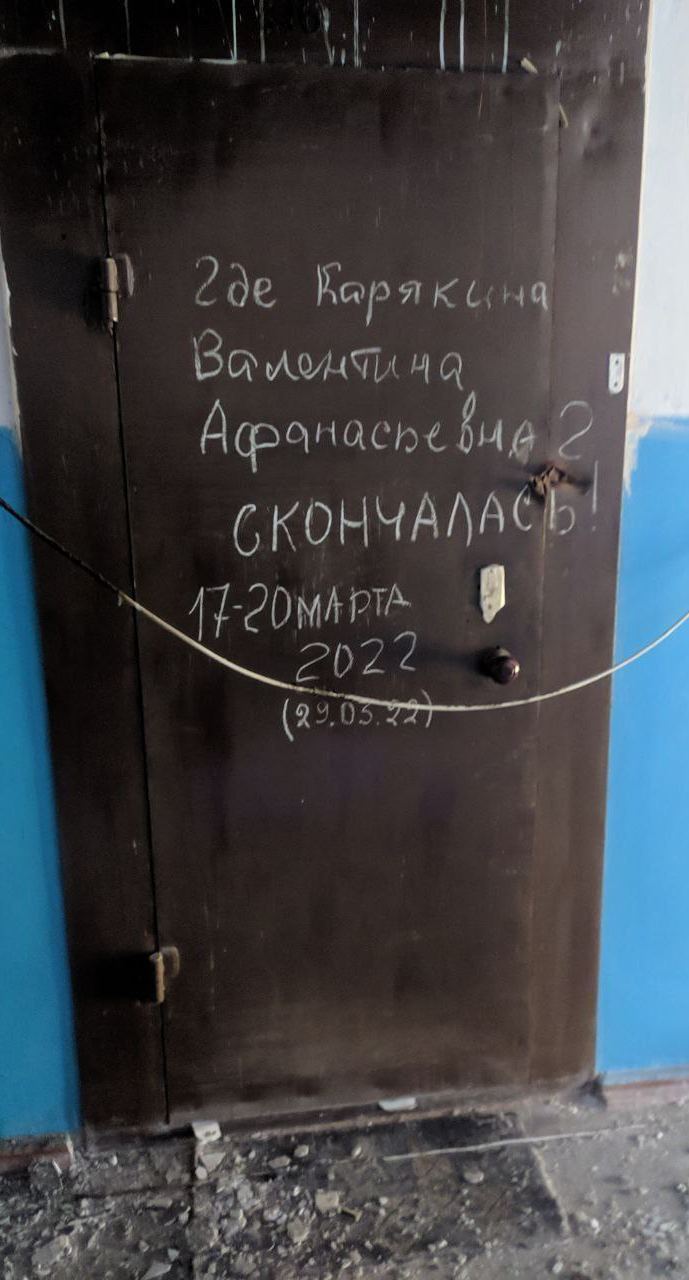 Names of Mariupol’s dead written on doors