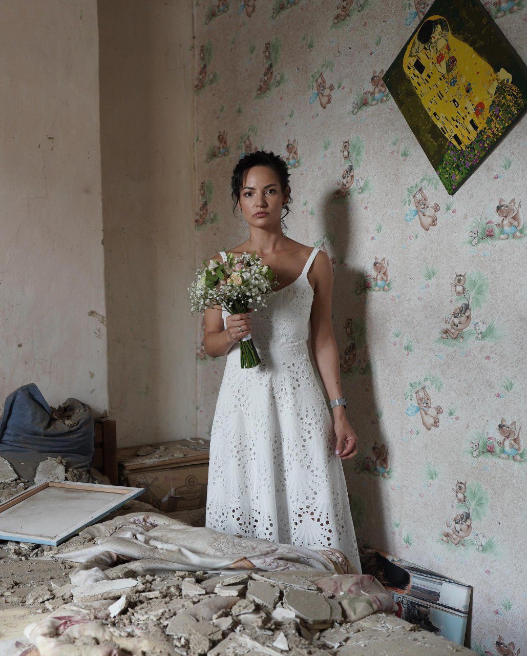 Bride at the ruins of her destroyed home