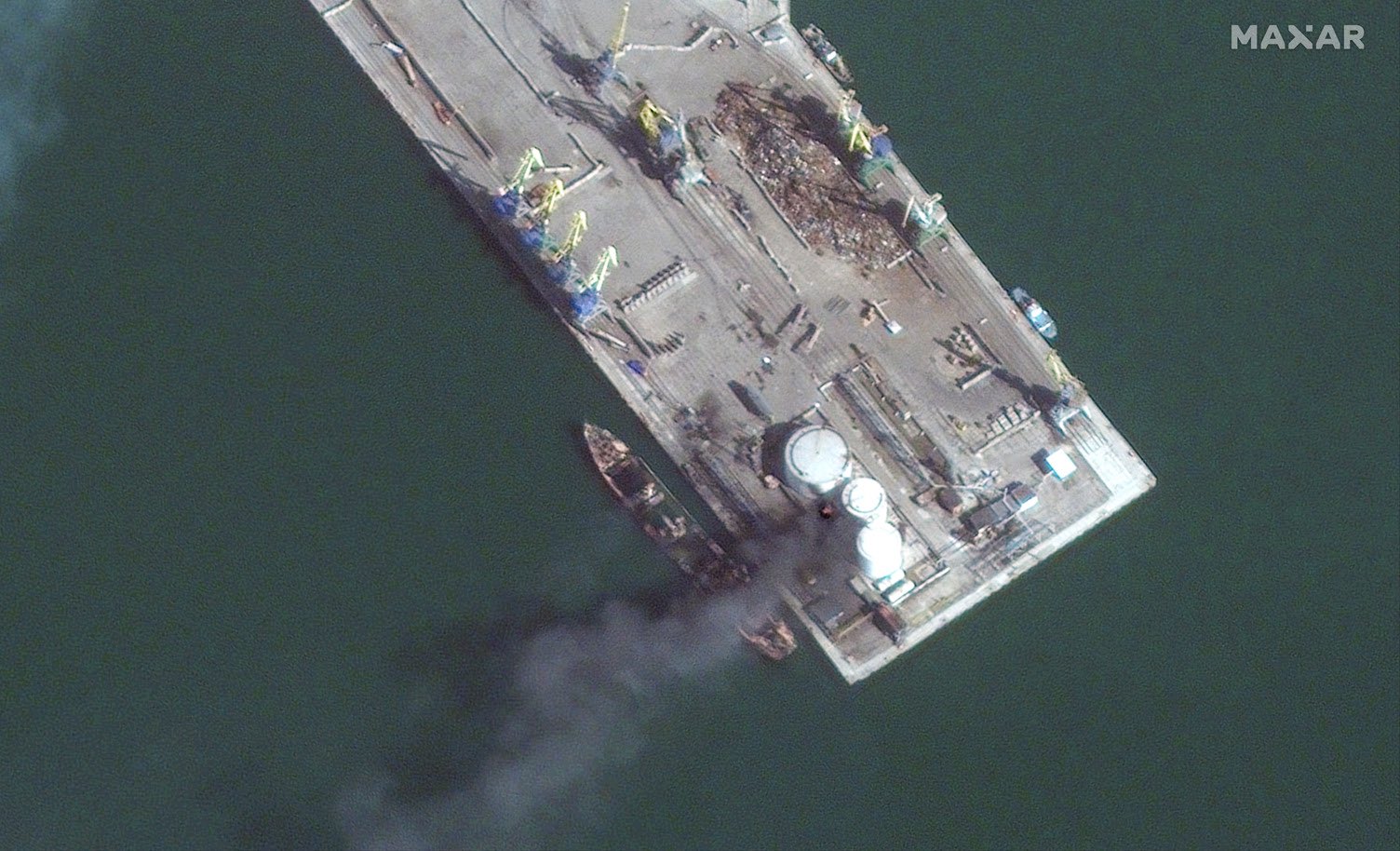 Satellite imagery shows burned Russian landing ship in Berdyansk