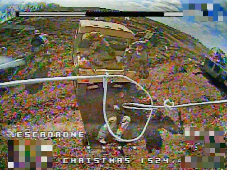Ukrainian FPV drone about to strike Chinese buggy with Russian troops