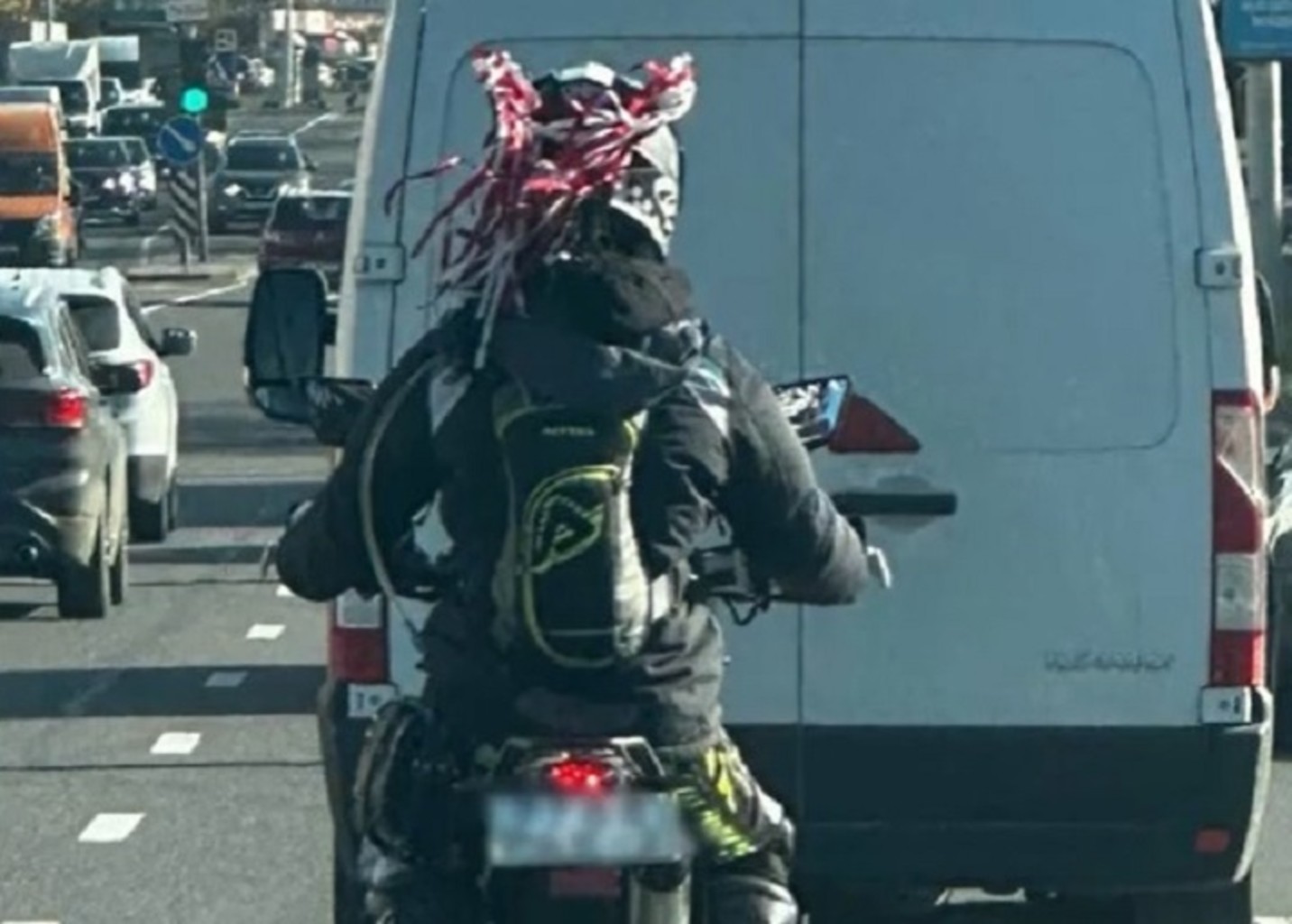 Belarusian woman arrested for wearing white and red ribbons on helmet