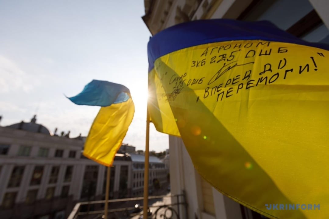 Flags hung on Ukrinform building by soldiers