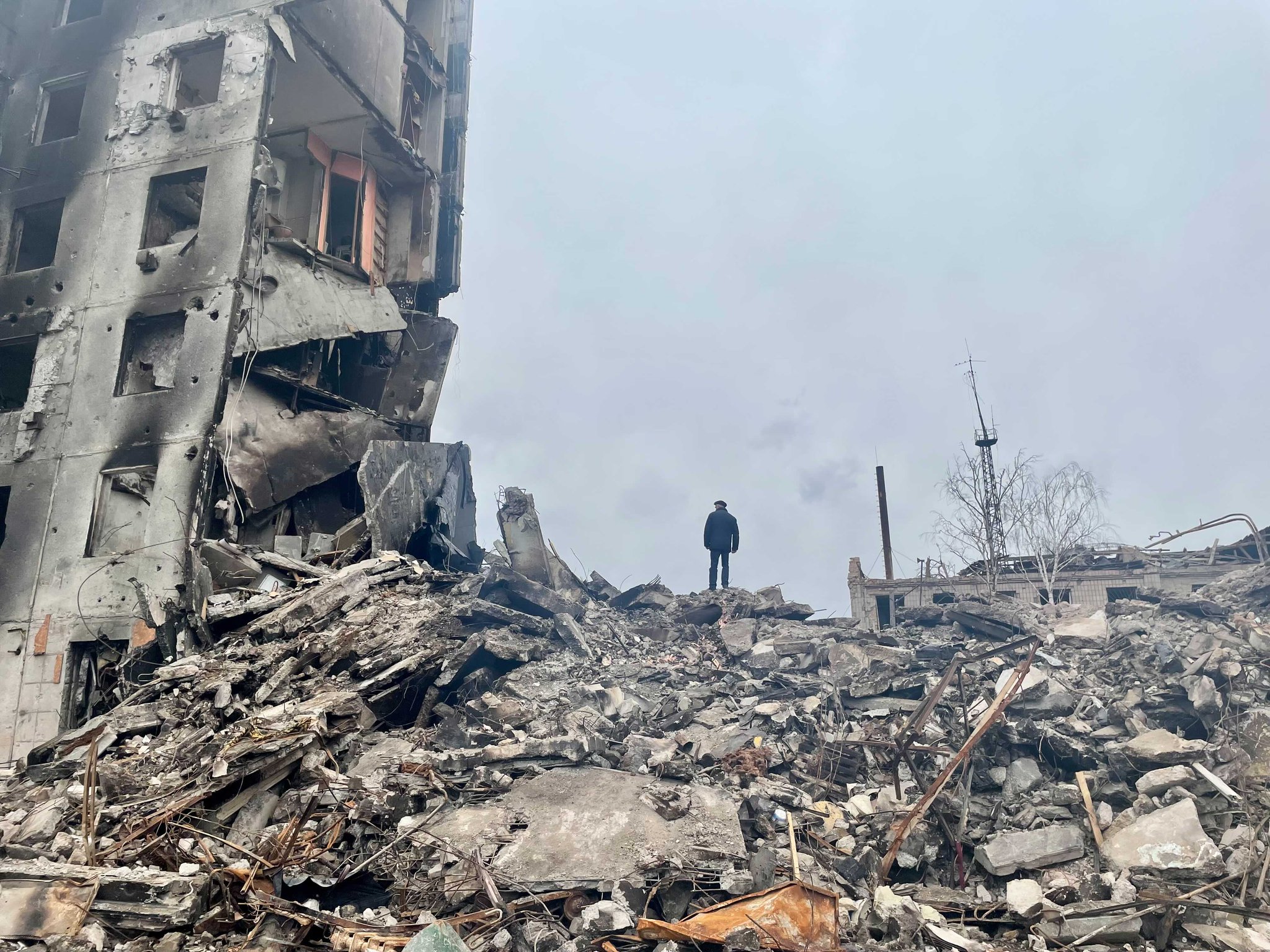 Man stands on ruins of building where his children lived in Borodyanka