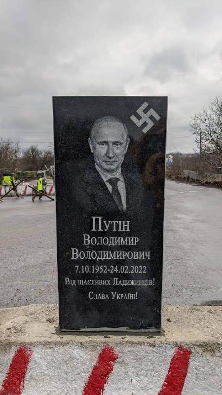 Tombstone for Putin at City Entrance