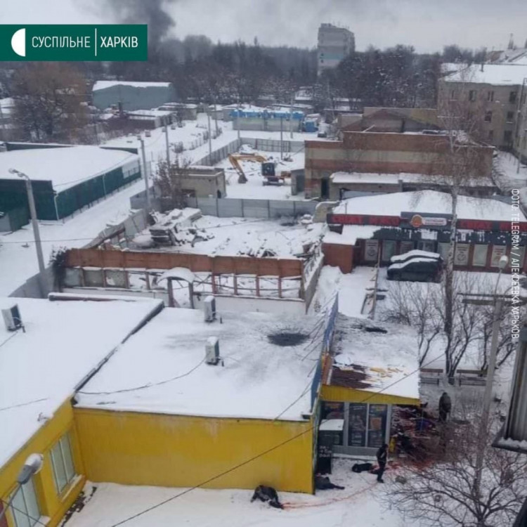 Russian rocket hits Ukrainian shoppers queue in Kharkiv suburb