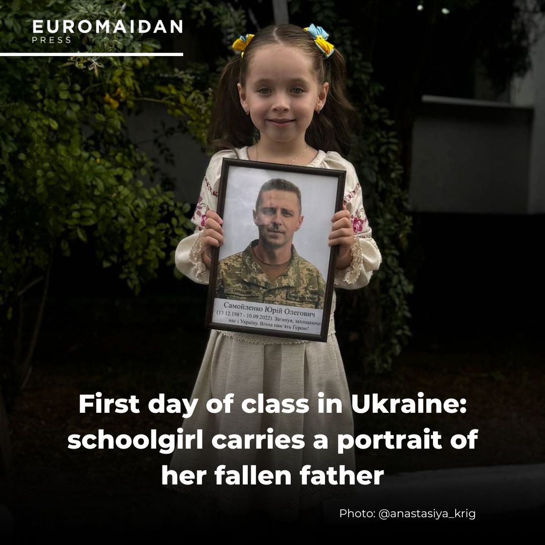 Olenka carries father’s portrait to school