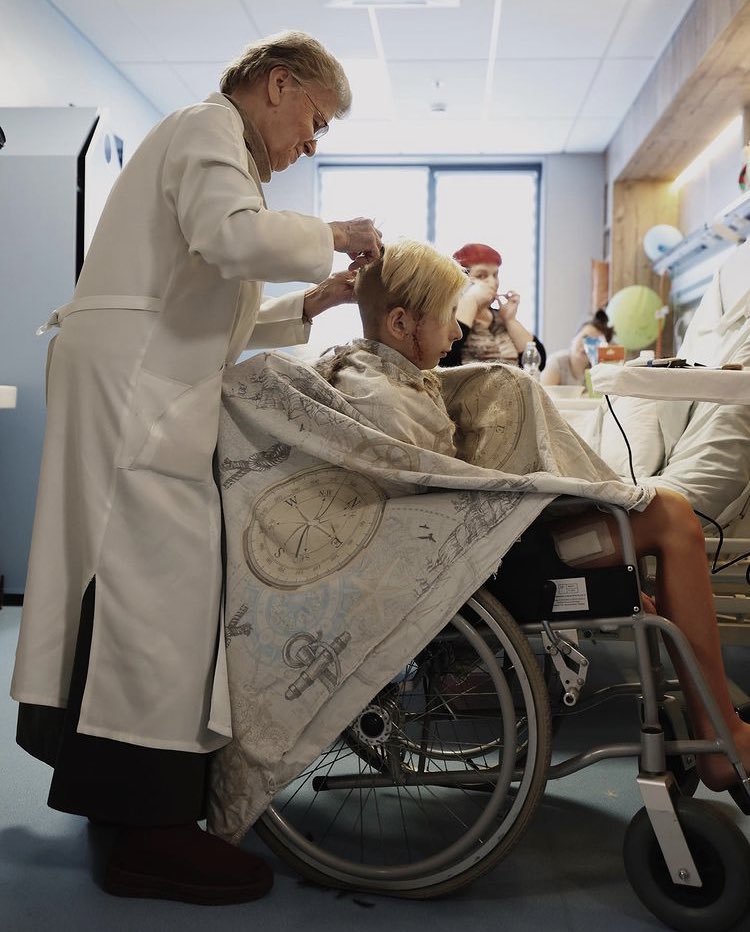Ukrainian boy Vova, 13, survives attack, gets haircut in hospital
