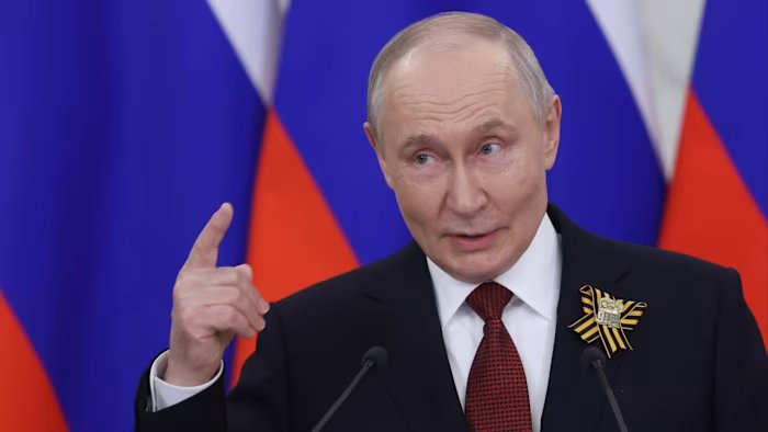 Russia cuts growth forecast, high rates, drone fears