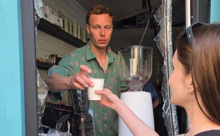 Russian missile destroys Kyiv café, hundreds queue through shattered window