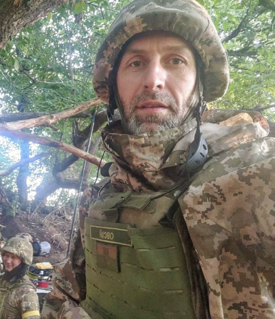 Ovsii, former journalist and religious leader, serves as chaplain with son.
