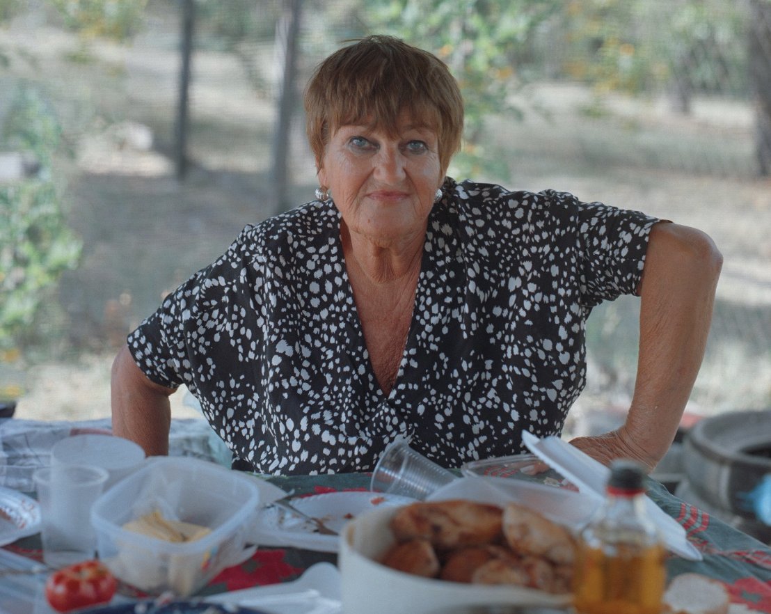 Olena invites strangers, cooks extra, sings old love songs in park